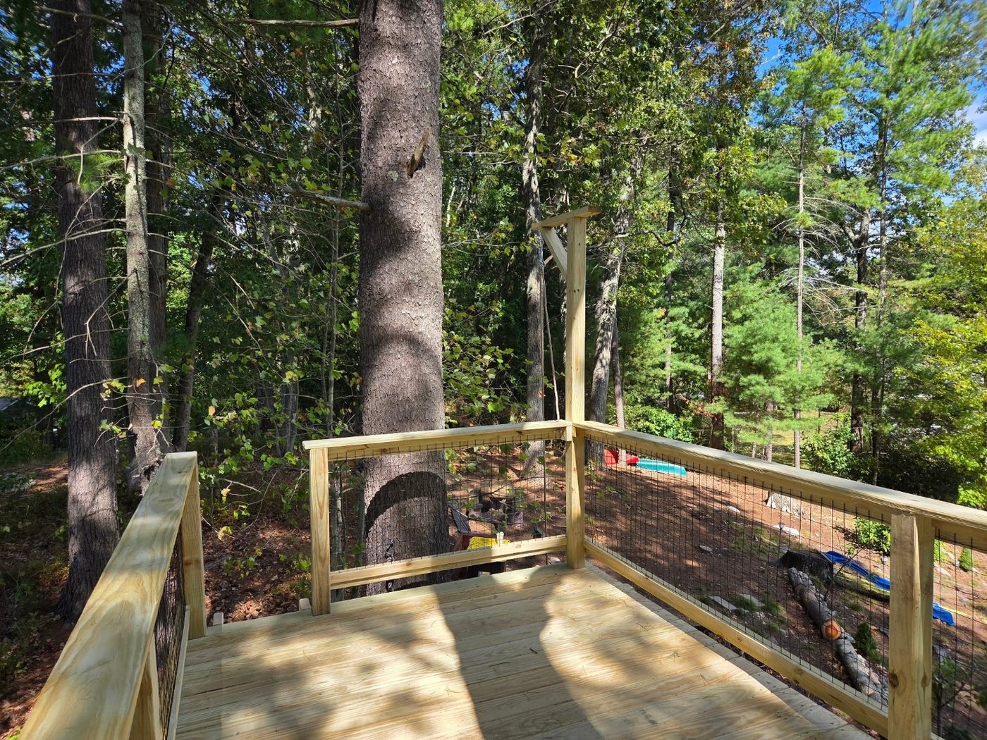 Treehouse deck with bucket pulley feature