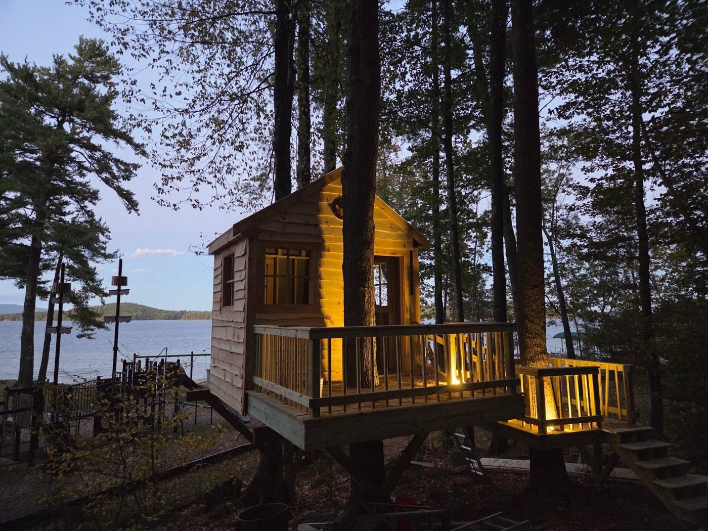 Open-air treehouse platform with cedar deck and railings