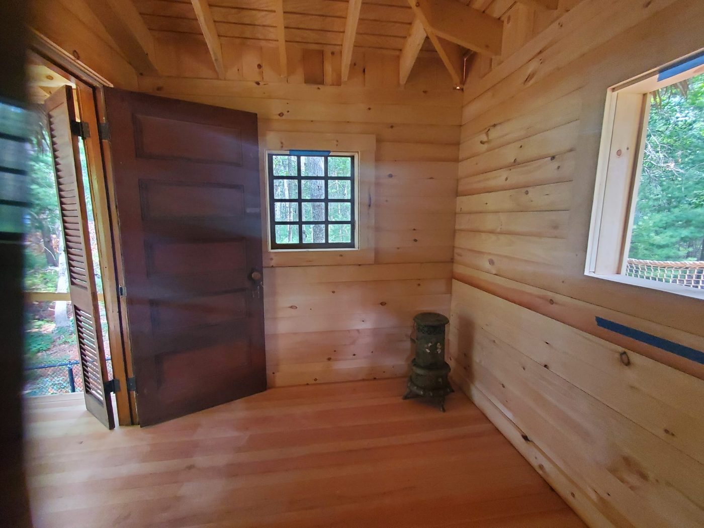 Finished shiplap interior inside an enclosed treehouse
